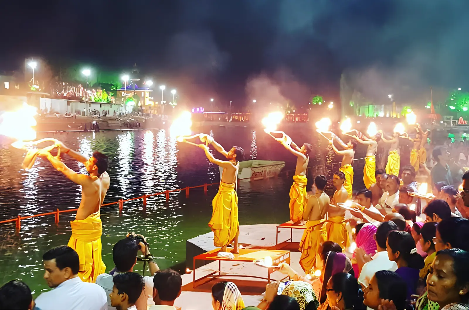 Priests performing the evening aarti with lamps at the ghats in Ujjain
